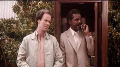 Al White and Dennis Haskins in The Dukes of Hazzard (1979)